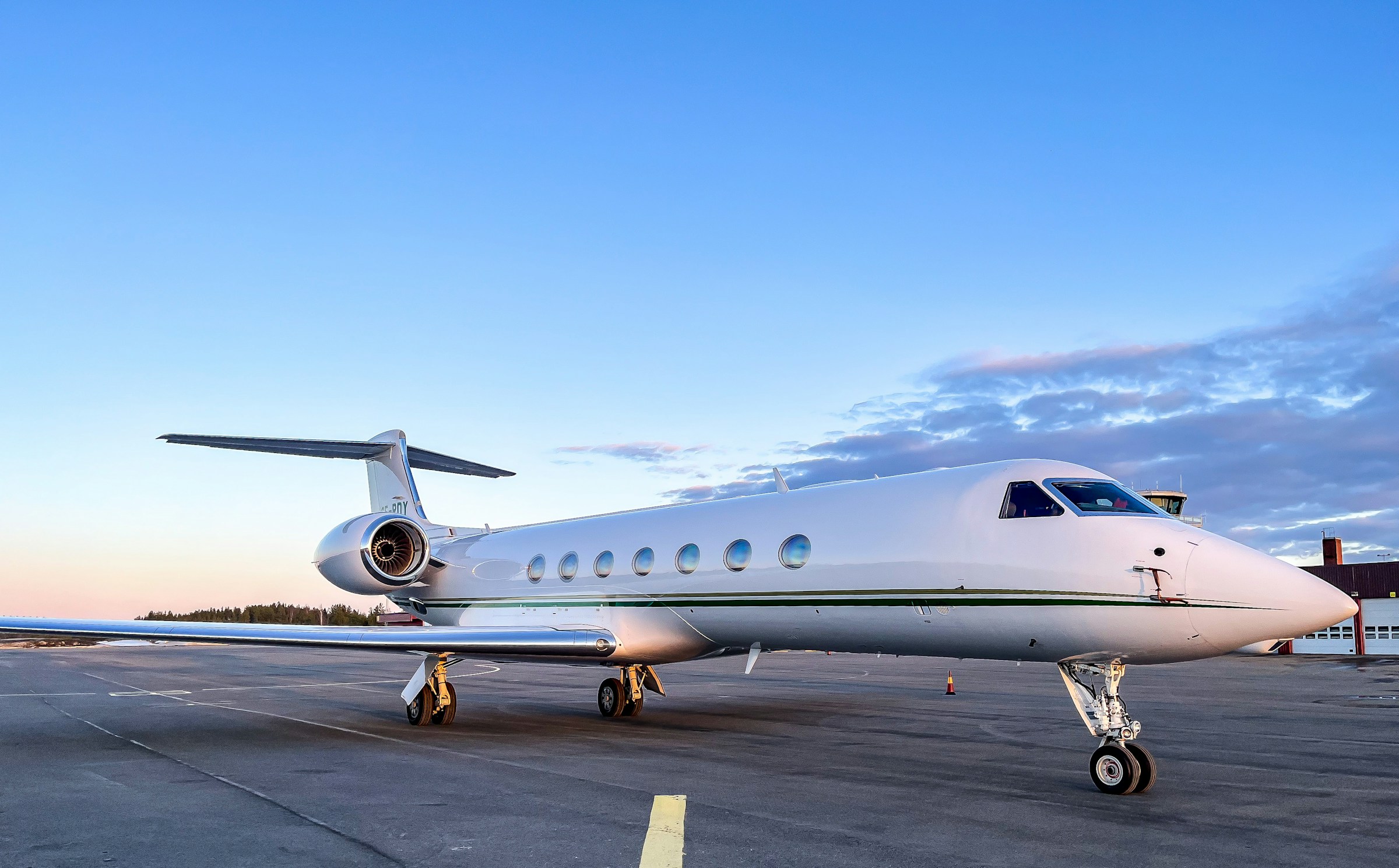 A private jet parked on the tarmac